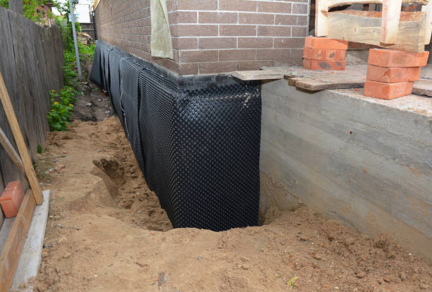 SJ Waterproofing Pros technician performing targeted Exterior Waterproofing assessment in Dowling, MI